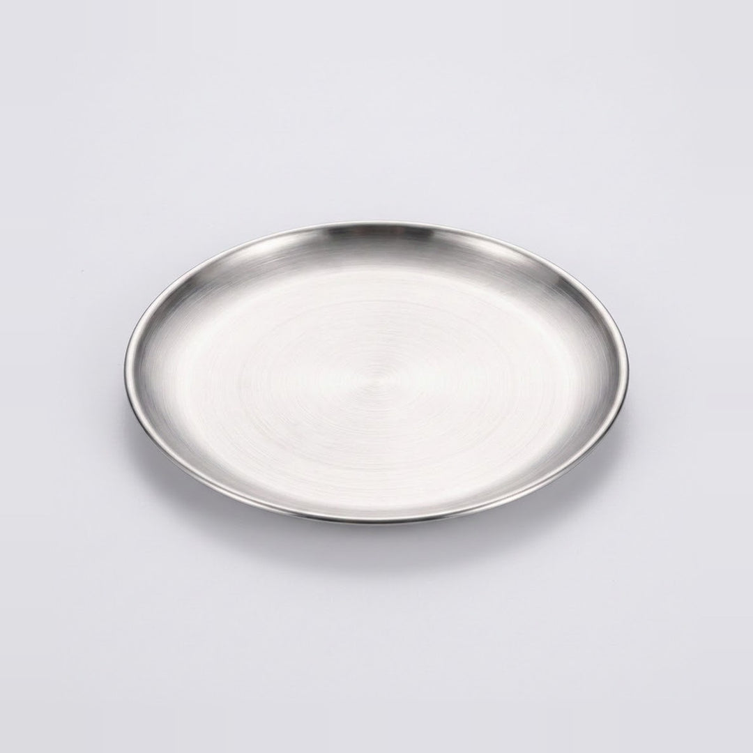 A round brushed stainless steel plate or tray with a polished rim, shown on a clean light gray background.
