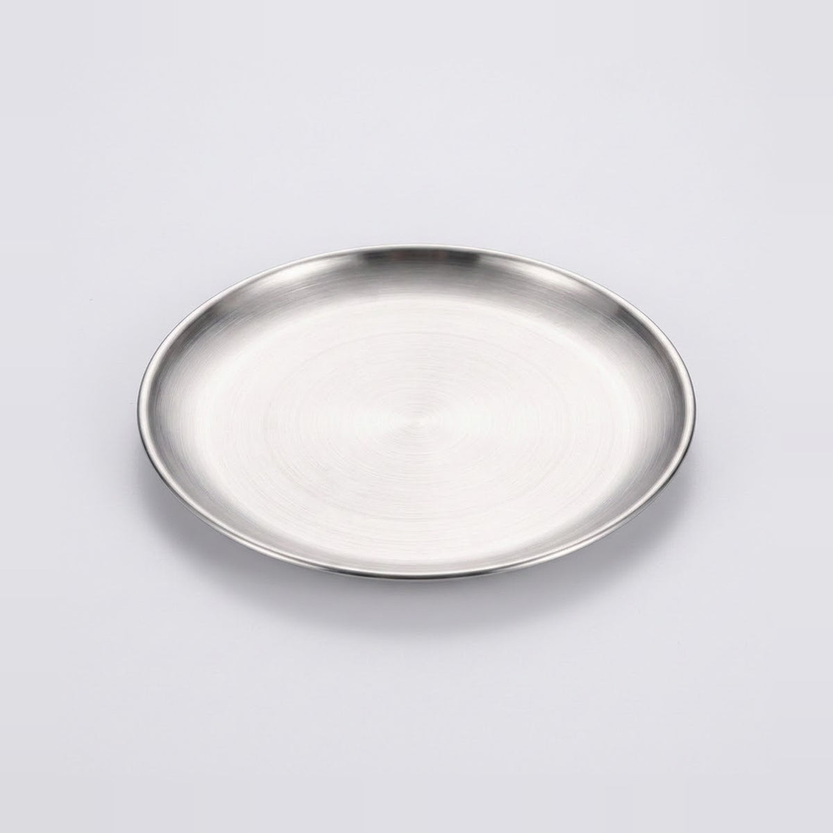 A round brushed stainless steel plate or tray with a polished rim, shown on a clean light gray background.