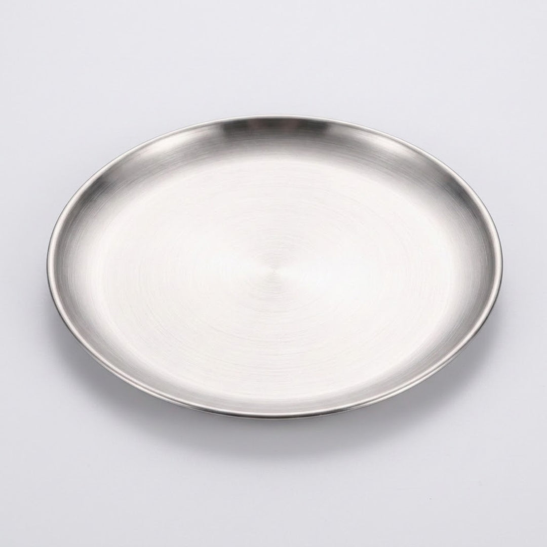 A round brushed stainless steel tray or shallow plate with a polished rim, shown from a top-down perspective on a light gray background.