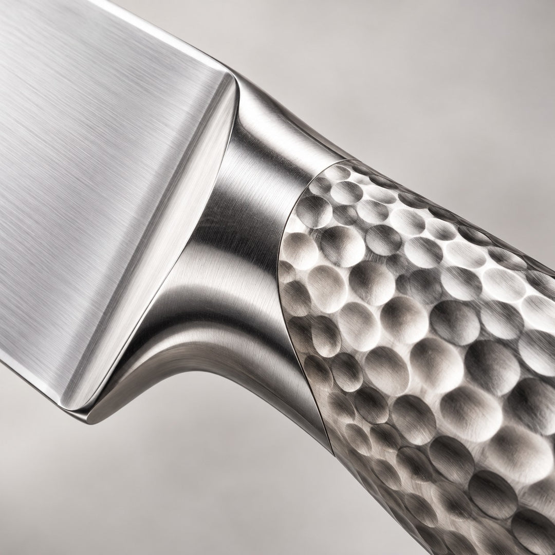14-piece knife block set close-up shows the hammered stainless steel handle and polished blade finish.