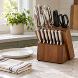 14-piece knife block set shown beside a dinner plate to show its countertop scale in a kitchen.
