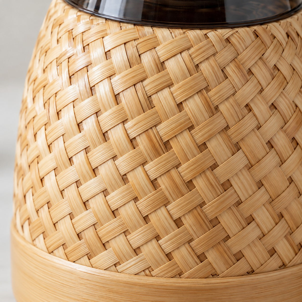 Bamboo Glass-Lined Thermos close-up reveals the glossy handwoven bamboo strips and base.