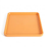 An orange square tray with rounded corners and raised rim, shown from a top-down perspective on a white background.