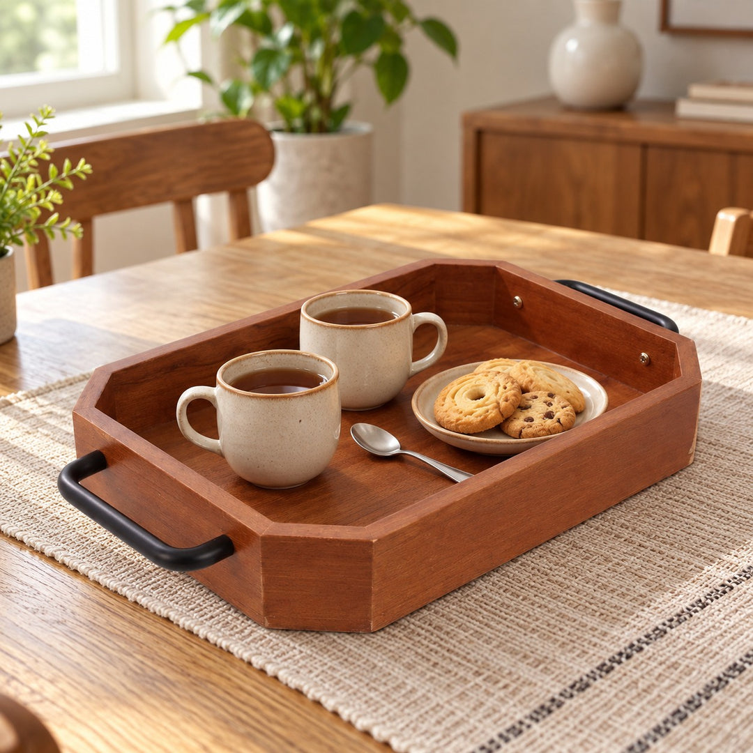 Rectangular wooden serving tray holds two mugs and cookies beside a teaspoon for scale.