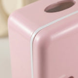 Close-up of a pink plastic dispenser or container with a rounded corner, a white seam line, and a dark oval opening near the top.