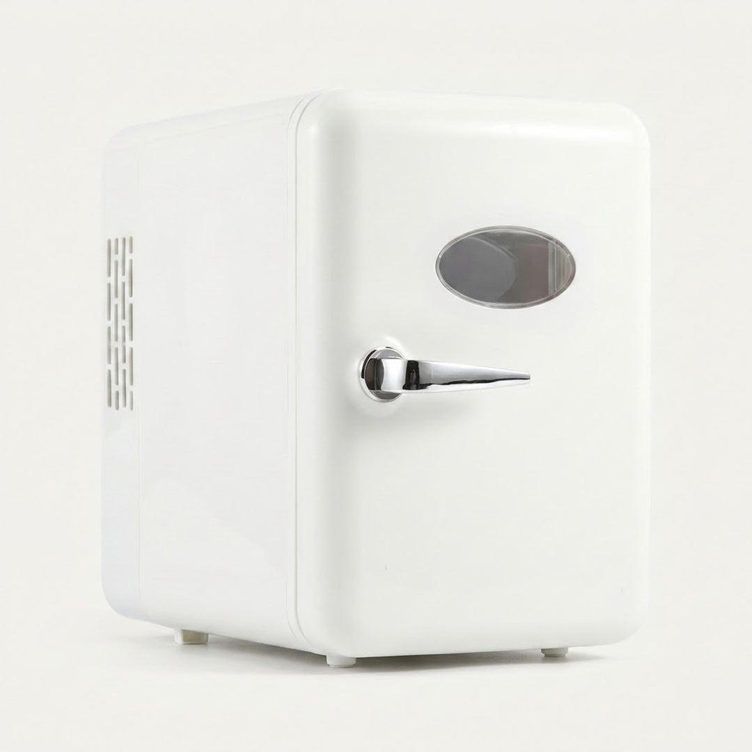 A white retro-style mini refrigerator with a silver handle and oval window, shown on a clean white background.