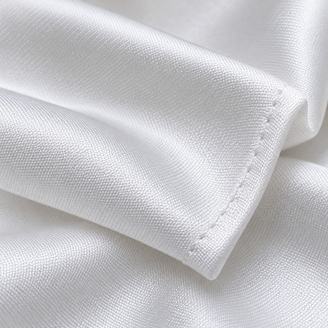 A macro view shows the fine woven texture and clean finished edge of the white polyester pocket square.