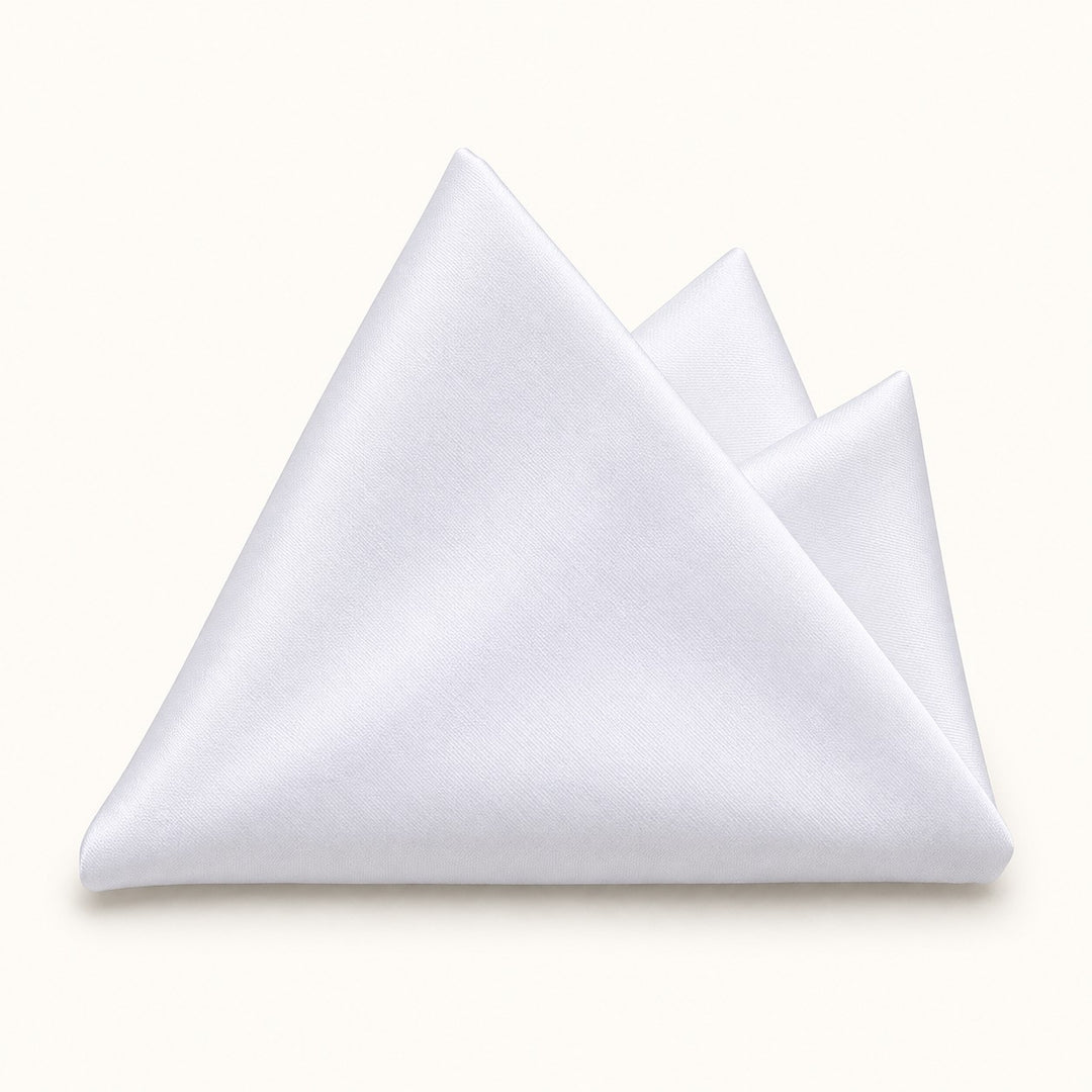 One plain white polyester pocket square is folded on a pale ivory studio background.