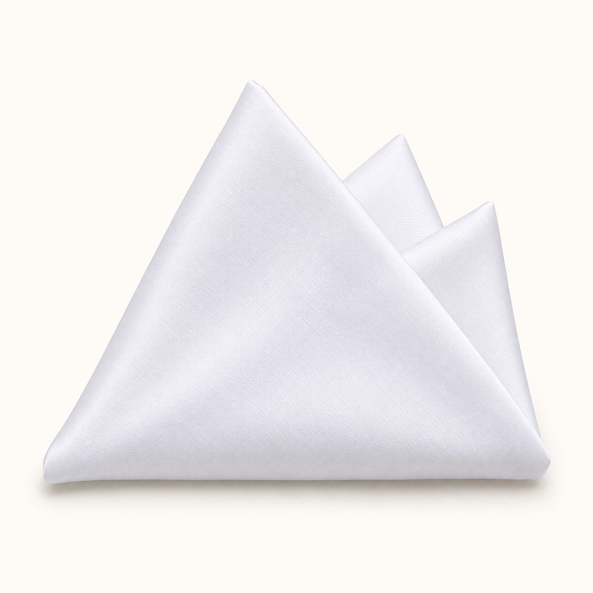 One plain white polyester pocket square is folded on a pale ivory studio background.