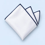 One white polyester pocket square with a navy border is folded on a pale blue background.