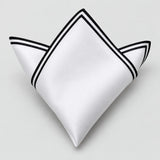 One white polyester pocket square with a double black border is folded on a pale gray background.