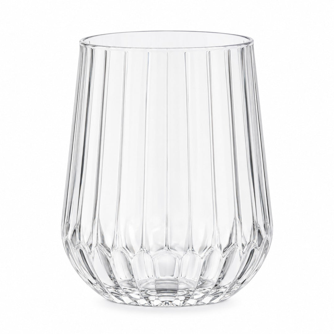 One clear stemless ribbed plastic wine glass stands alone on a white background.