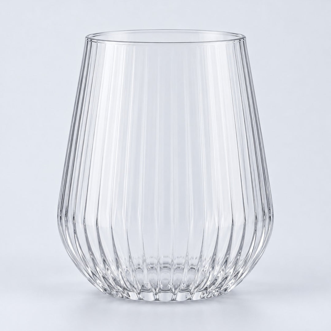 Single clear-rim stemless ribbed plastic wine glass centered on a pale gray backdrop.