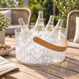 Clear Ice Bucket with Handle holds iced bottles on an outdoor patio table.