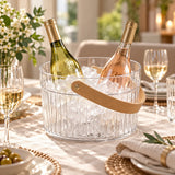 Clear Ice Bucket with Handle chills wine bottles for serving at a dining table.