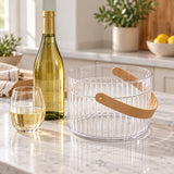 Clear Ice Bucket with Handle sits beside a wine bottle and glass for scale.