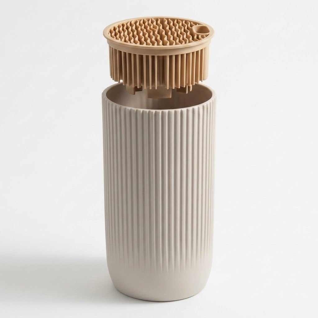 A ribbed ceramic cup in a warm off-white color with a matching bamboo lid featuring silicone bristles, set against a plain white background.