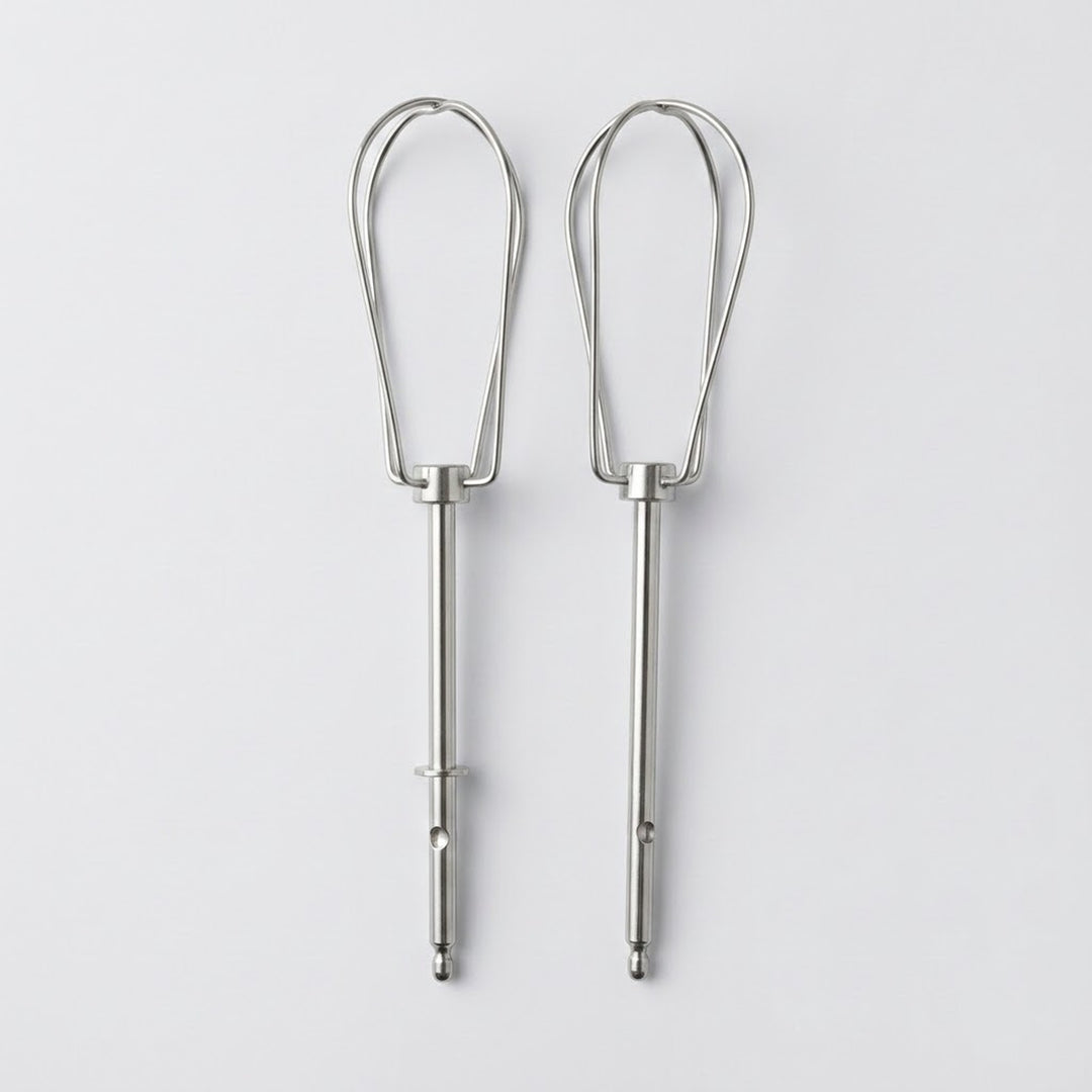 Two silver metal whisk attachments for mixing or whipping, shown side by side on a light gray background.