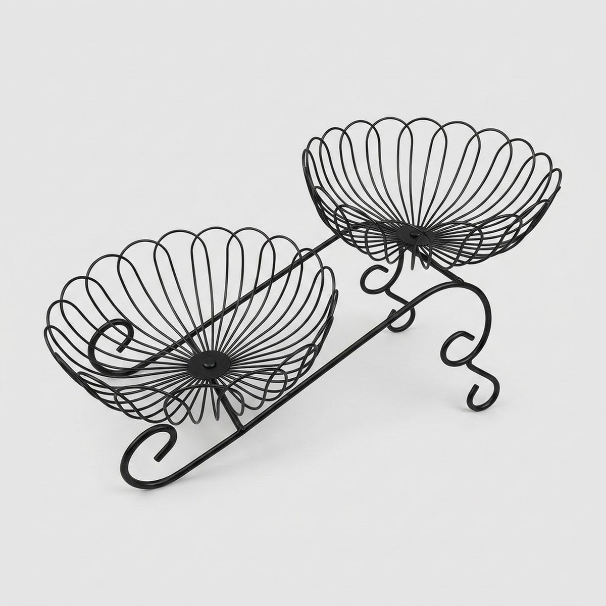 Black metal wire double-tier bowl stand on a light gray background.