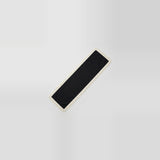 A long, narrow black rectangular mat or runner with a light beige fringed edge, shown diagonally on a light gray gradient background.