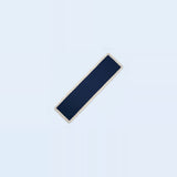 A long, narrow rectangular navy blue fabric accessory with a light beige or cream border, shown diagonally on a very pale blue background.