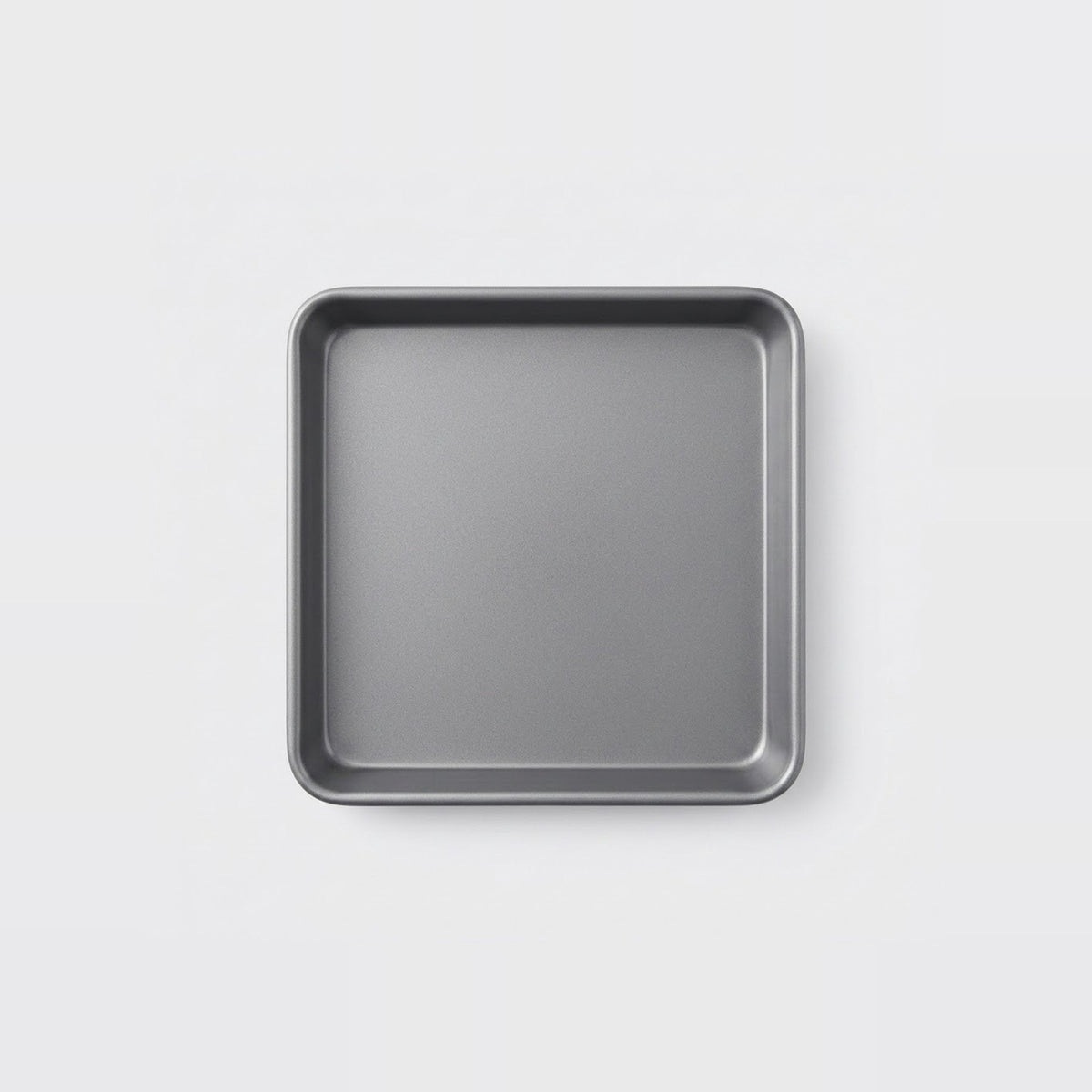 A square gray metal baking pan with raised rounded corners, shown from a top-down view on a clean white background.