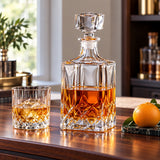 Diamond Square glass whiskey decanter stands beside a lowball tumbler to show its serving scale.