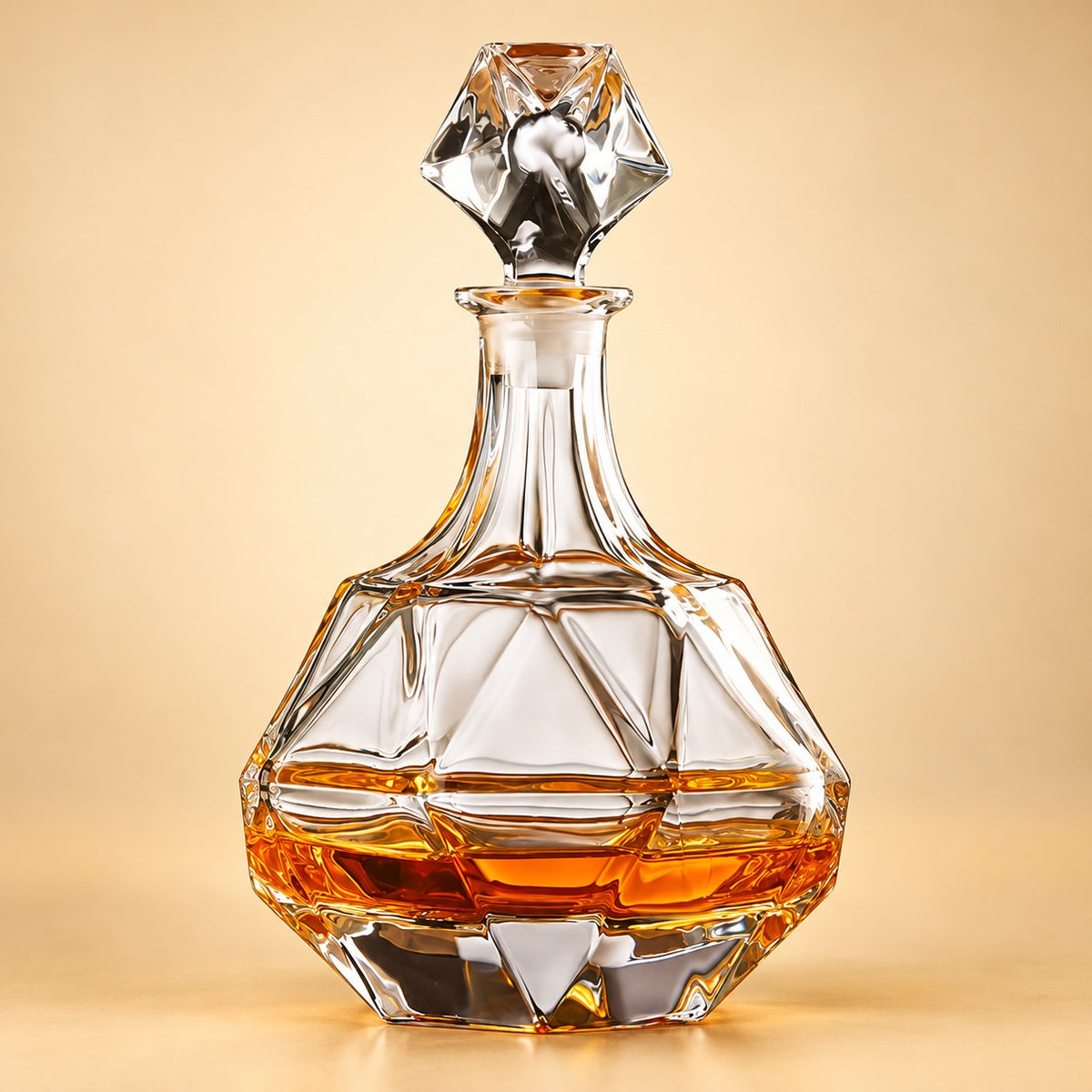 Faceted Bell glass whiskey decanter with angular body and bell-shaped stopper on a pale warm backdrop.