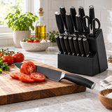 The black kitchen knife set keeps meal-prep tools organized beside a tomato-cutting board.