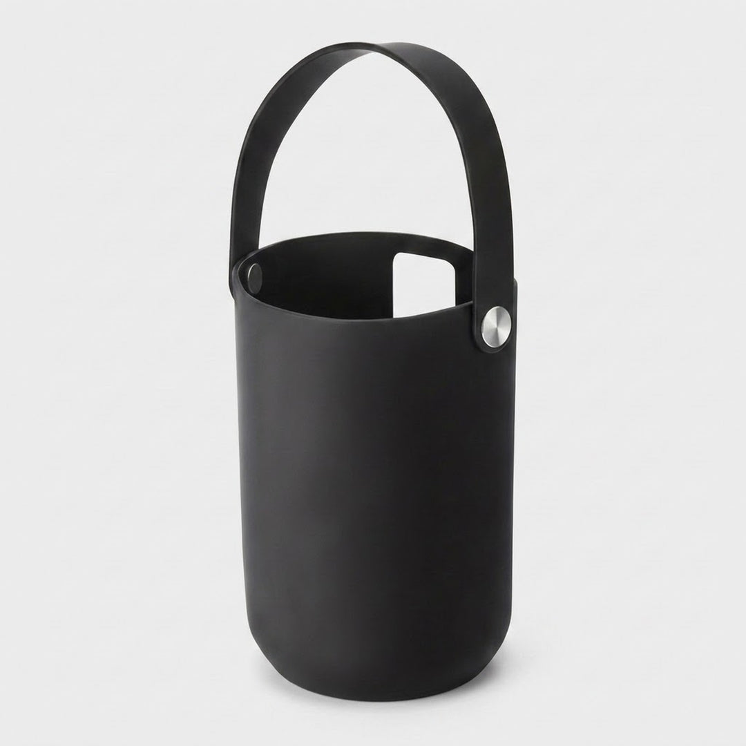 A matte black silicone bucket-style ice bucket with a matching handle and a silver metal rivet, shown on a light gray background.