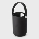 A matte black silicone bucket-style ice bucket with a matching handle and a silver metal rivet, shown on a light gray background.