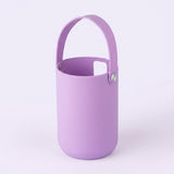 A light purple cylindrical bucket-style container with a matching arched handle and a small metal rivet, shown on a plain light background.