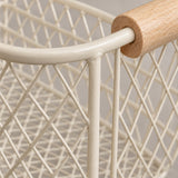 Close-up of the beige wire basket's coated metal mesh, welded joints, and wood grain.