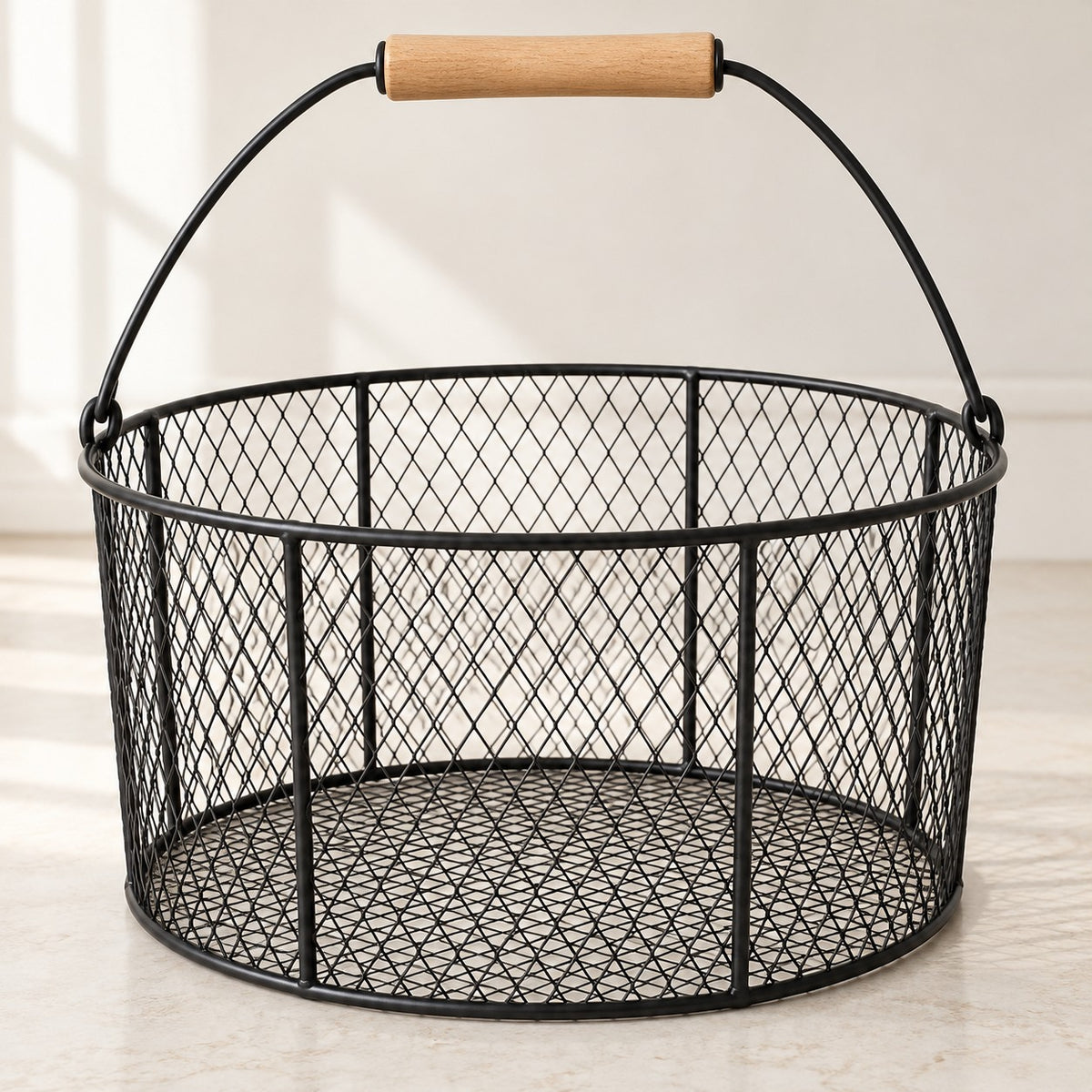 Black Wire Basket with Wood Handle highlights its open mesh and comfortable wood grip.