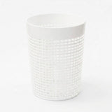 A white cylindrical plastic basket with a textured grid pattern, shown on a seamless white background.