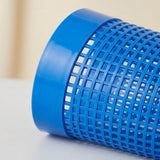 A close-up of a bright blue plastic cylindrical mesh filter or cone-shaped component with a grid pattern, resting on a light surface.