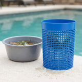 A blue cylindrical plastic trash can with a grid-patterned body stands on a concrete poolside surface next to a gray plastic basin.