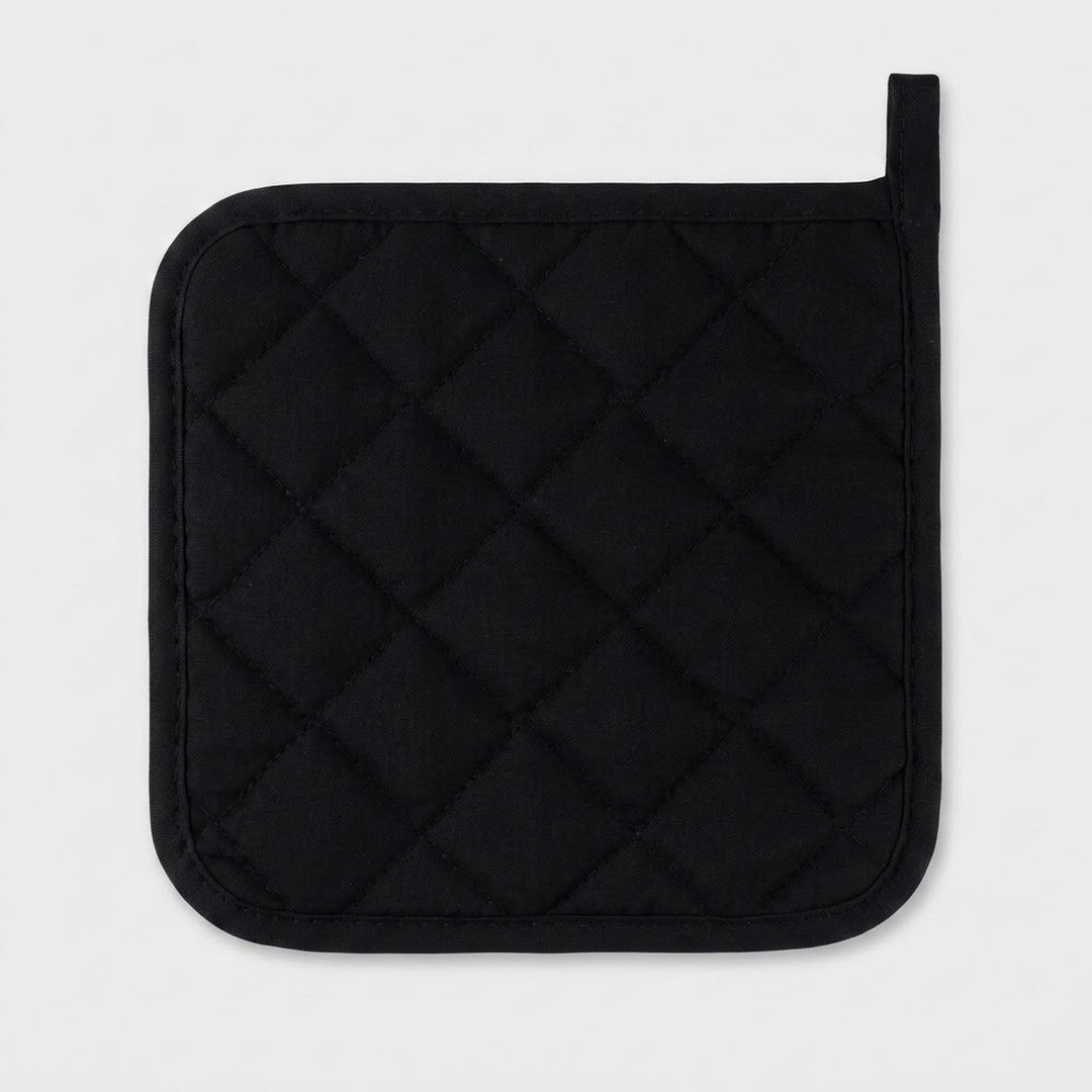 A black quilted pot holder with a diamond pattern and a small loop at the top right, shown on a light gray background.