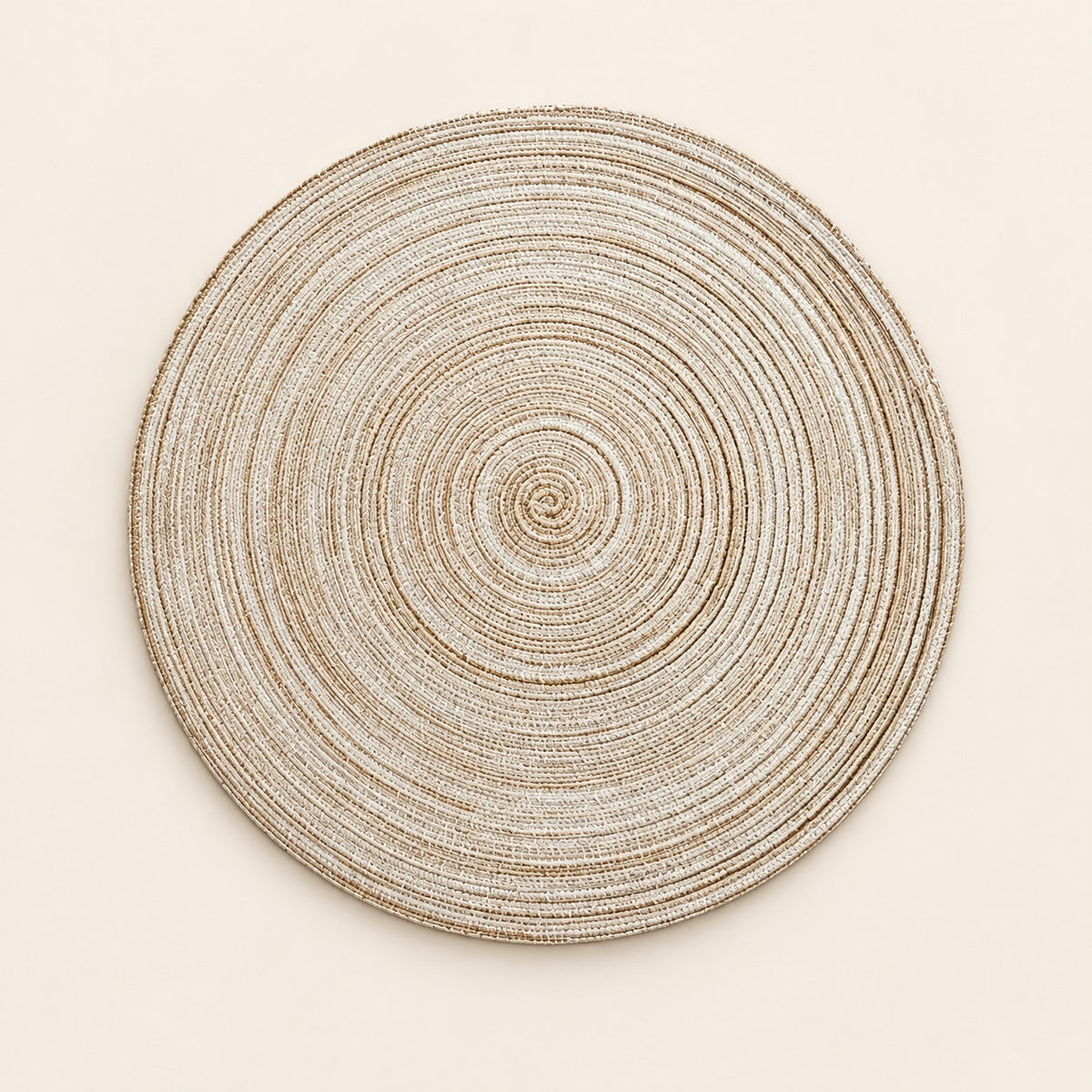 Light Beige Round Woven Table Mat centered on a matching pale beige studio background.
