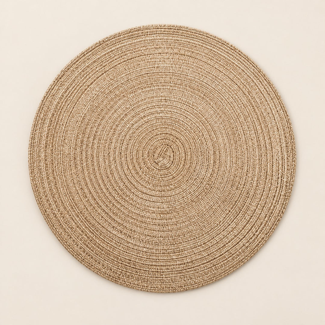 Tan Round Woven Table Mat centered on a light tan studio background.