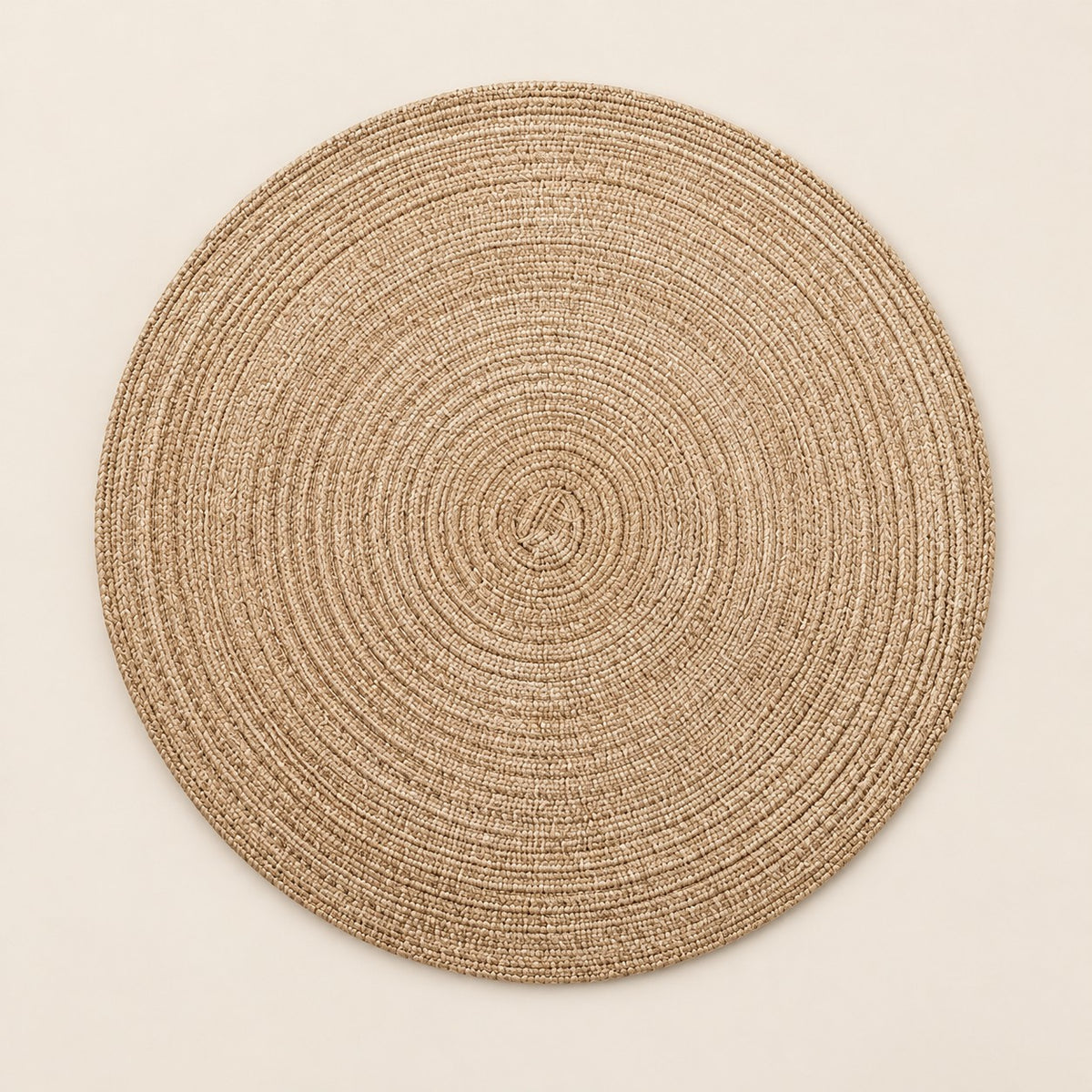 Tan Round Woven Table Mat centered on a light tan studio background.