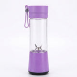 A portable personal blender bottle with a purple base and lid, a clear glass bottle body, and a purple carrying loop, shown on a white background.