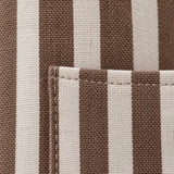 Close-up of the brown striped apron showing its woven linen-polyester texture and stitched pocket edge.