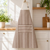Brown striped kitchen apron highlights its roomy front pocket and adjustable neck strap.