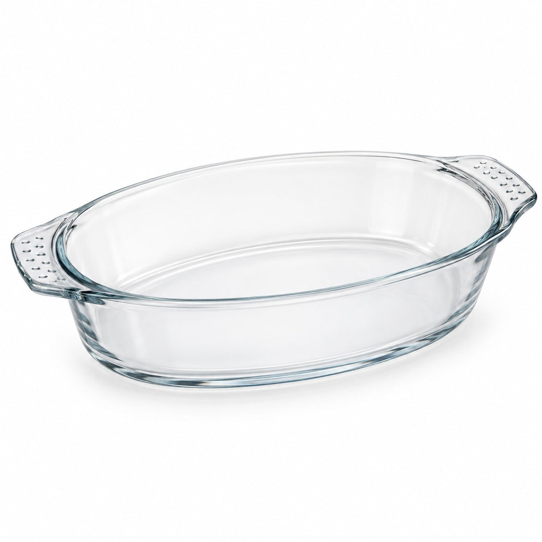 One empty oval borosilicate glass baking dish with integrated textured handles on white.