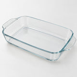 Rectangular clear glass baking dish shown alone on a pale gray studio background.