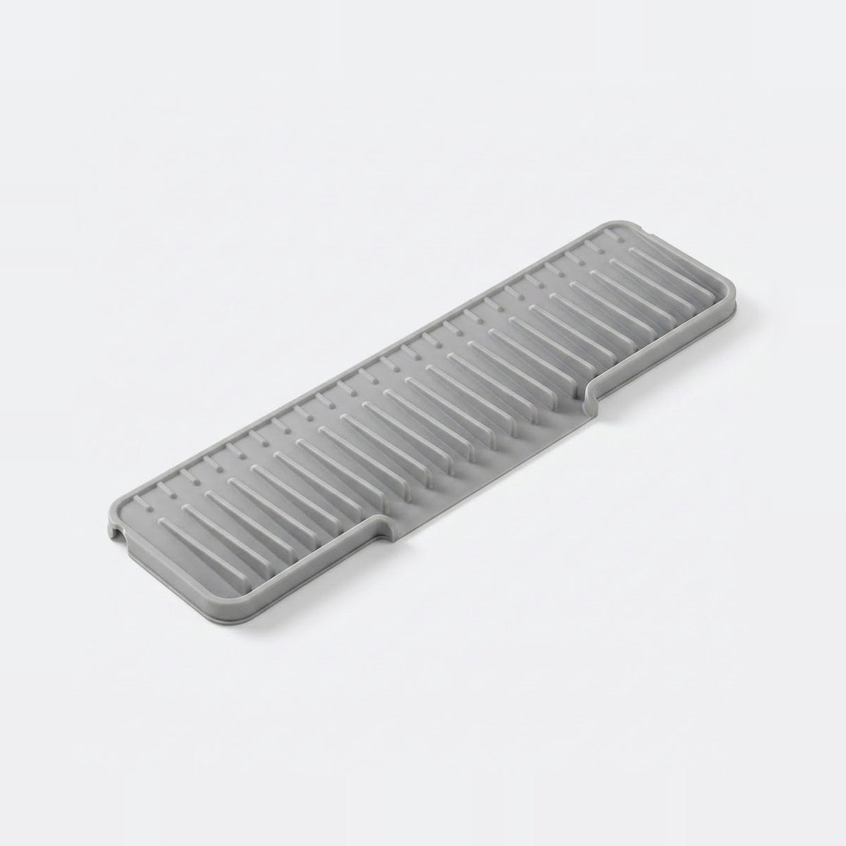 Black plastic tool or component on a white background