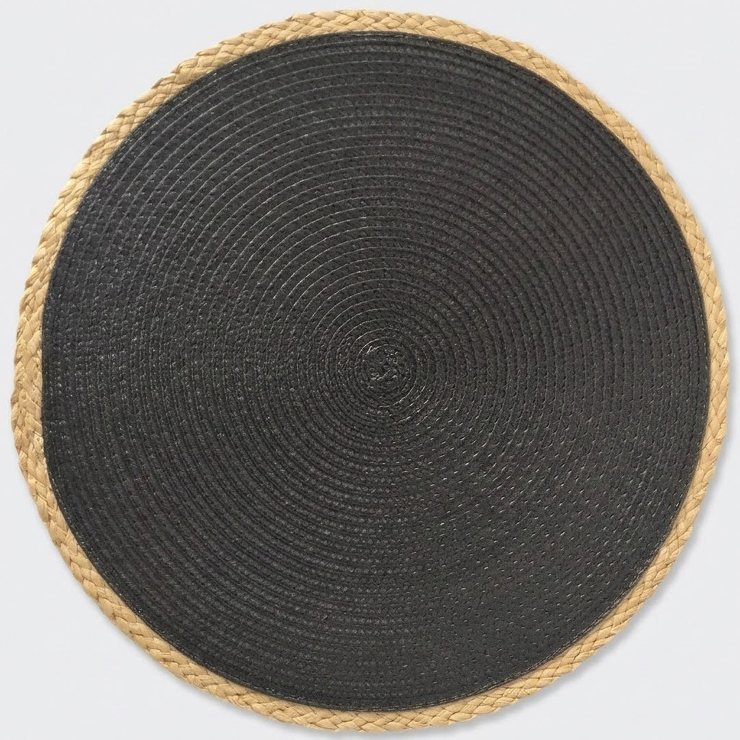 A round woven mat with a dark charcoal gray center and a natural tan braided border, shown from a top-down view on a light gray background.