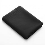 A folded black sheet or fabric bedding piece shown on a clean white background.