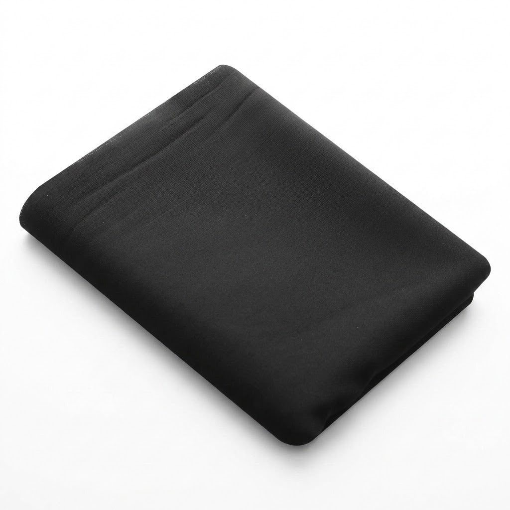 A folded black sheet or fabric bedding piece shown on a clean white background.
